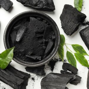 charcoal powdered charcoal and leaves on white background 1