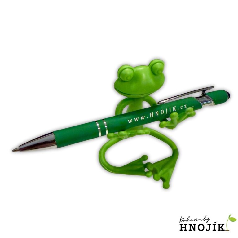 Grüne Froschfigur mit einem grünen Kugelschreiber