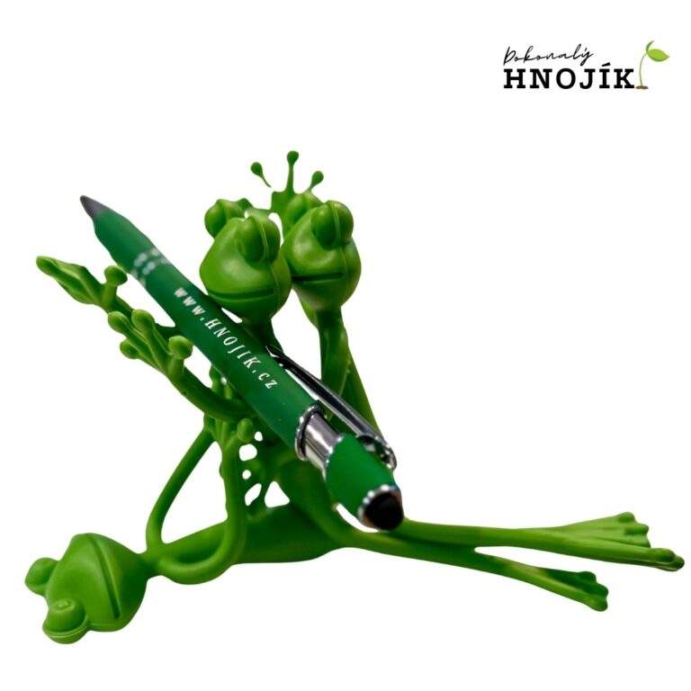 Grüne Froschfiguren mit einem grünen Kugelschreiber