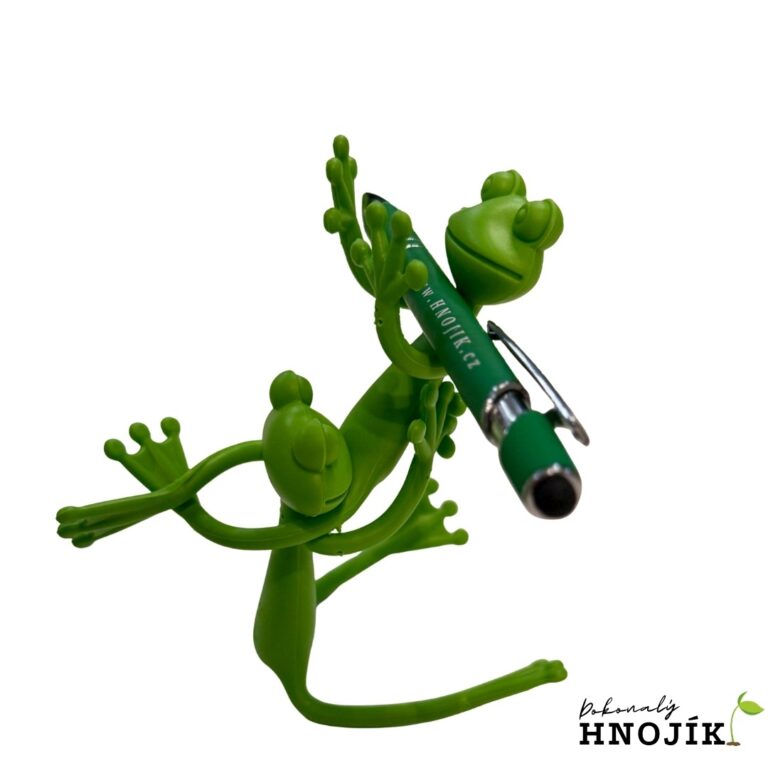 Grüne Froschfigur mit einem grünen Kugelschreiber
